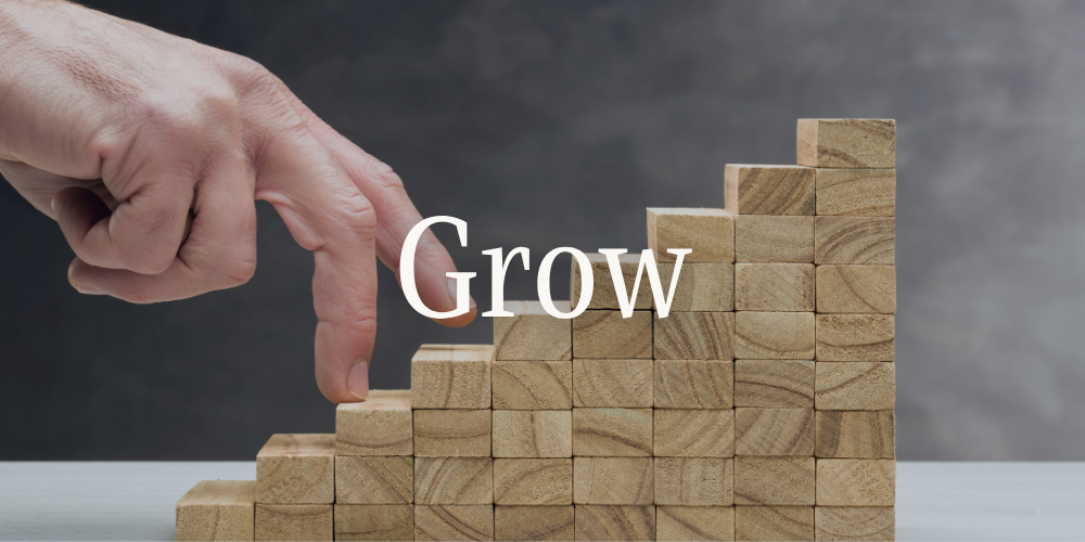 "Grow" — rising wooden blocks showing business growth, Design Map Studio Dubai